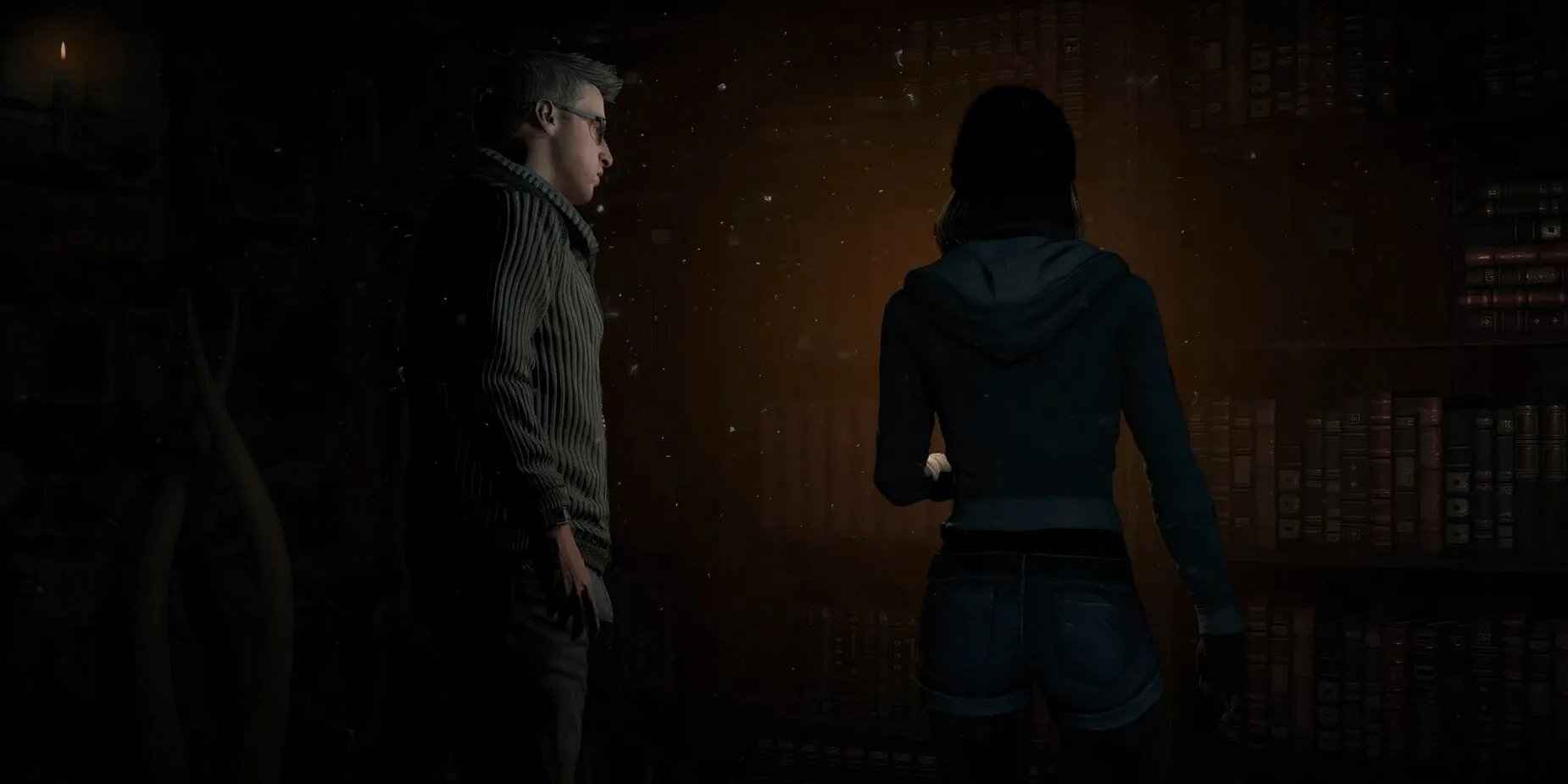 Cảnh gameplay Until Dawn với các nhân vật đứng gần kệ sách trong một căn phòng thiếu sáng