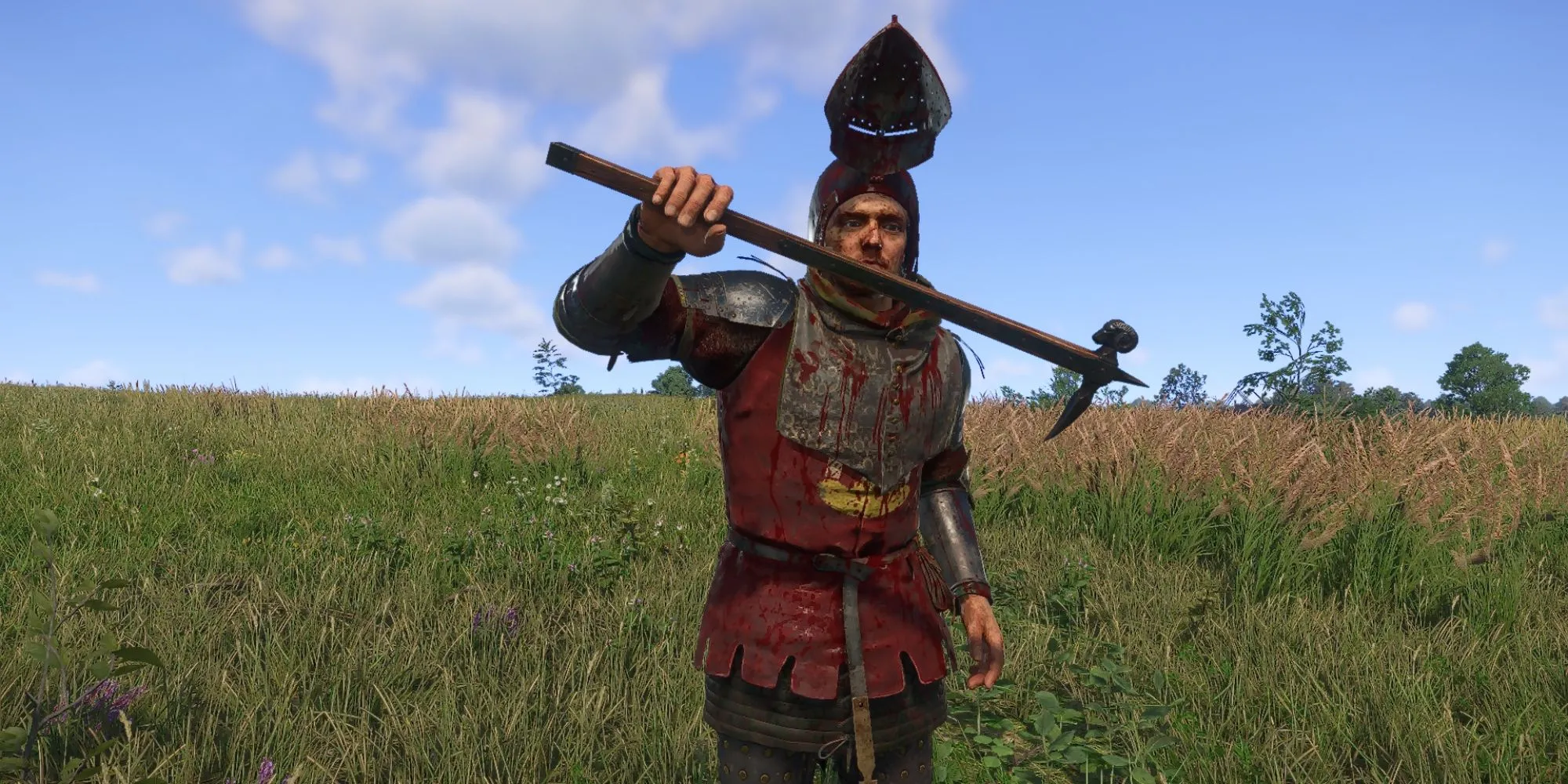 Henry đang cầm Búa Đầu Cừu trong Kingdom Come Deliverance 2