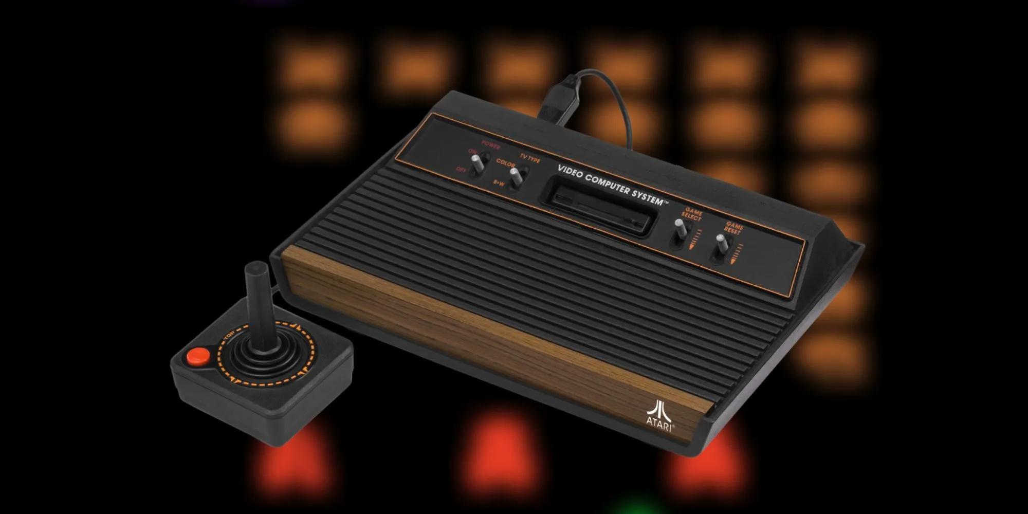Máy chơi game Atari 2600 cổ điển với mặt ốp gỗ và tay cầm joystick đơn giản