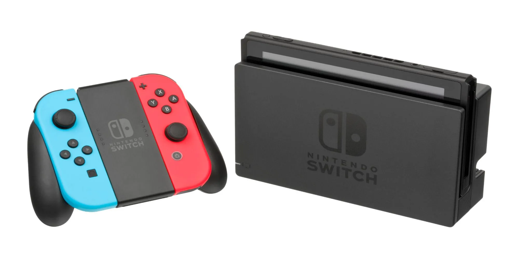 Một tay cầm Nintendo Switch màu đỏ và xanh dương bên cạnh máy console đang được gắn vào dock trên nền trắng.