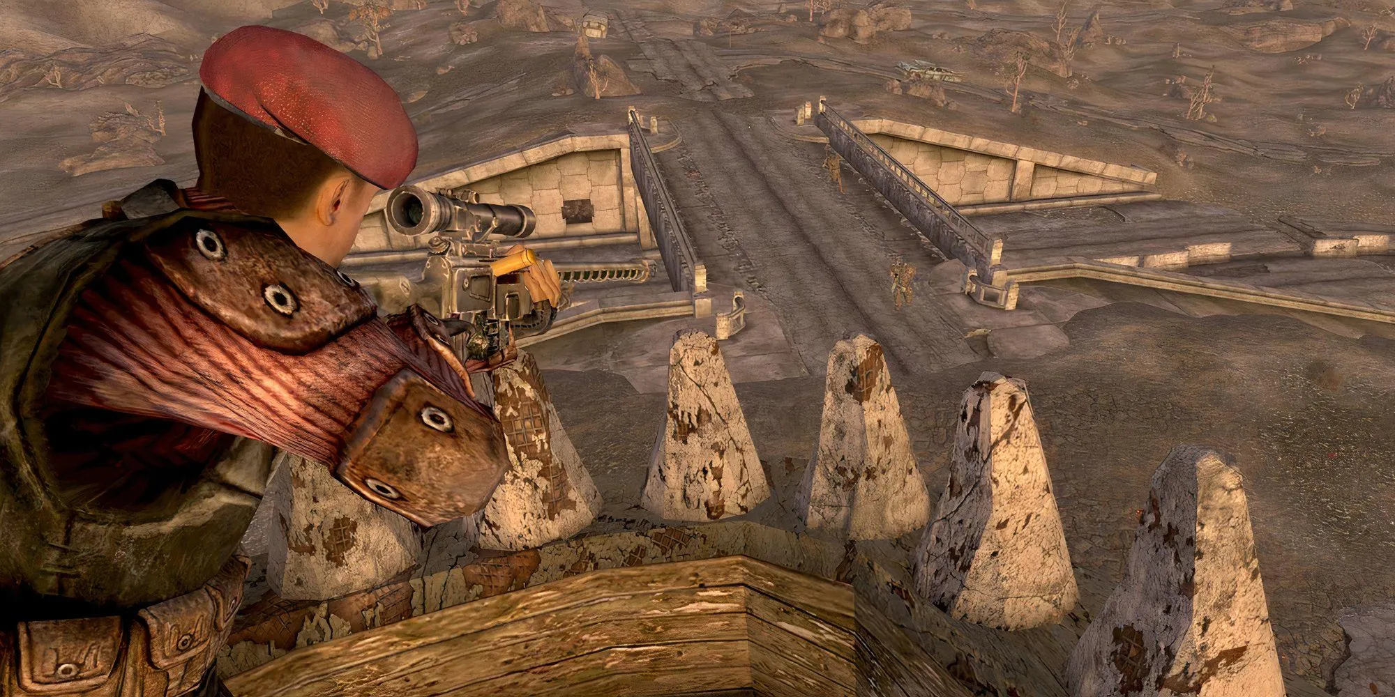 Nhân vật chính trong Fallout: New Vegas sử dụng súng bắn tỉa từ trên cao, bao quát một khu vực hoang tàn sau chiến tranh hạt nhân.