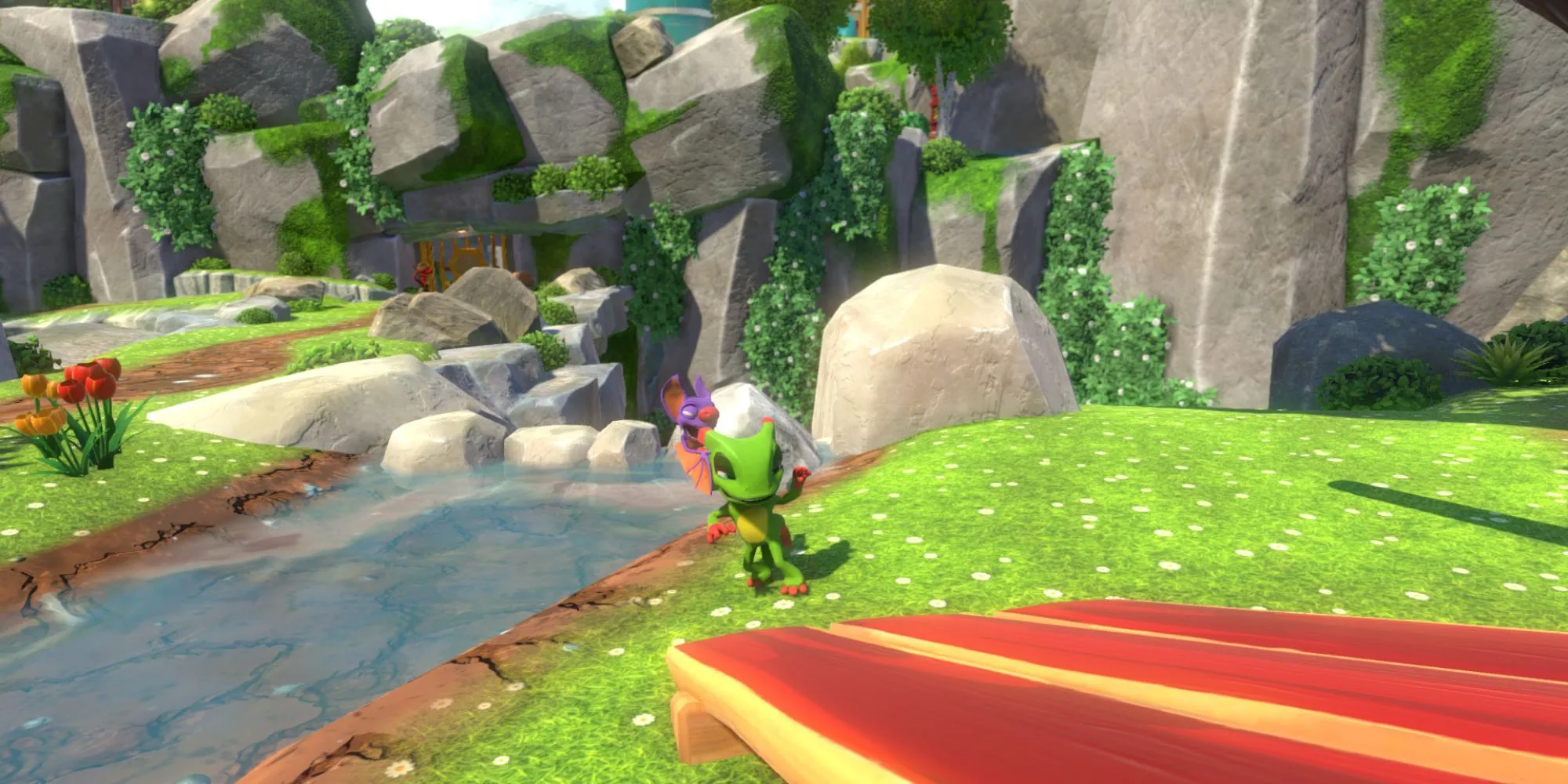 Yooka và Laylee đứng cạnh bờ sông trong thế giới đầy màu sắc của Yooka-Laylee