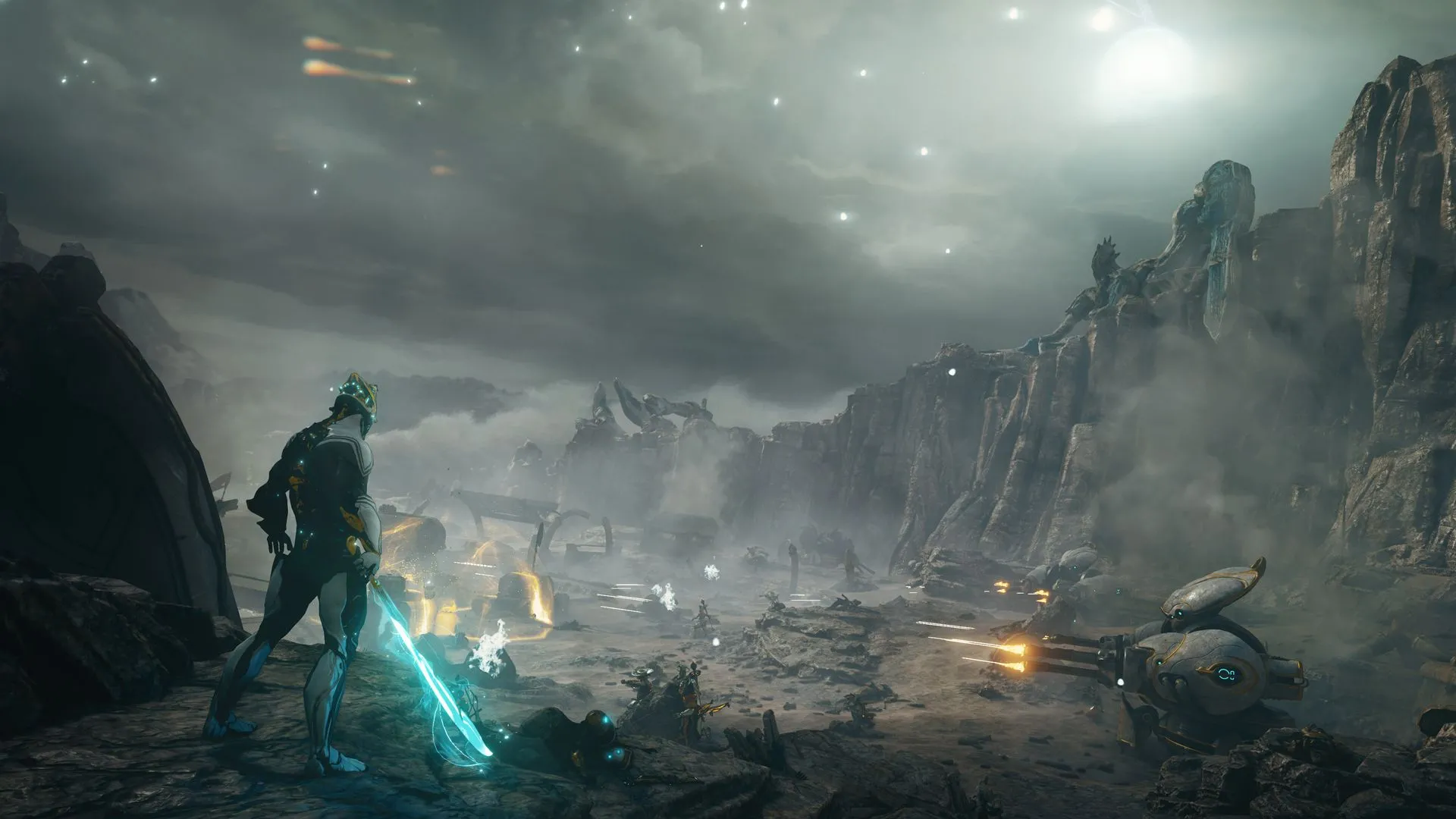 Excalibur Prime đứng trên chiến trường trong Warframe, ánh sáng xanh bao quanh