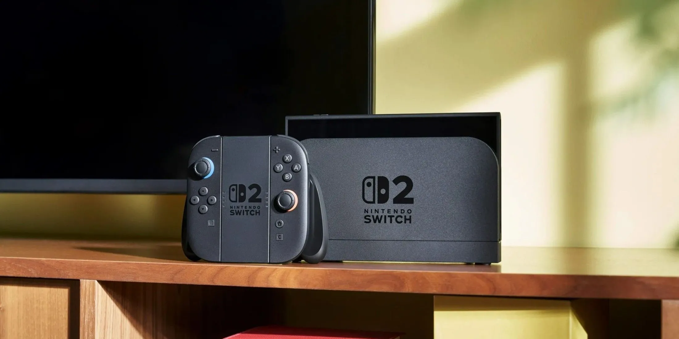 Máy chơi game Nintendo Switch 2 đặt trong dock kết nối với TV và tay cầm Joy-Con